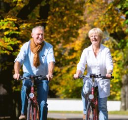 Photograph of a couple riding bikes